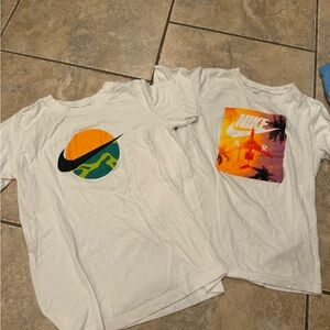 Two (2) Nike SS Tshirts. White logo tshirts. Kids Sz L. Barely worn